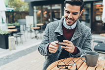 clean cut guy looking at his phone
